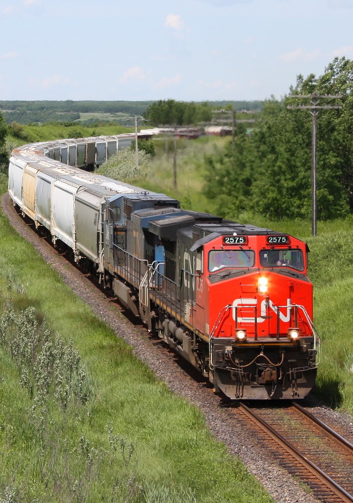 CN 114 with CN 2575 and IC 2466 drag this train out of the valley.