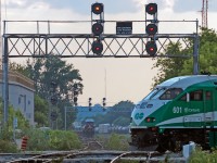 The last revenue GO train clears the diamond at West Toronto while in the background CP 9840 East CP 255\'s train sits back on track 2 awaiting the clear signal to proceed east to Toronto Yard. 