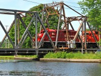 The conductor exchanges pleasantries with the bridgetender as the Havelock crosses the swing span over the Trent Severn waterway. 1539hrs.