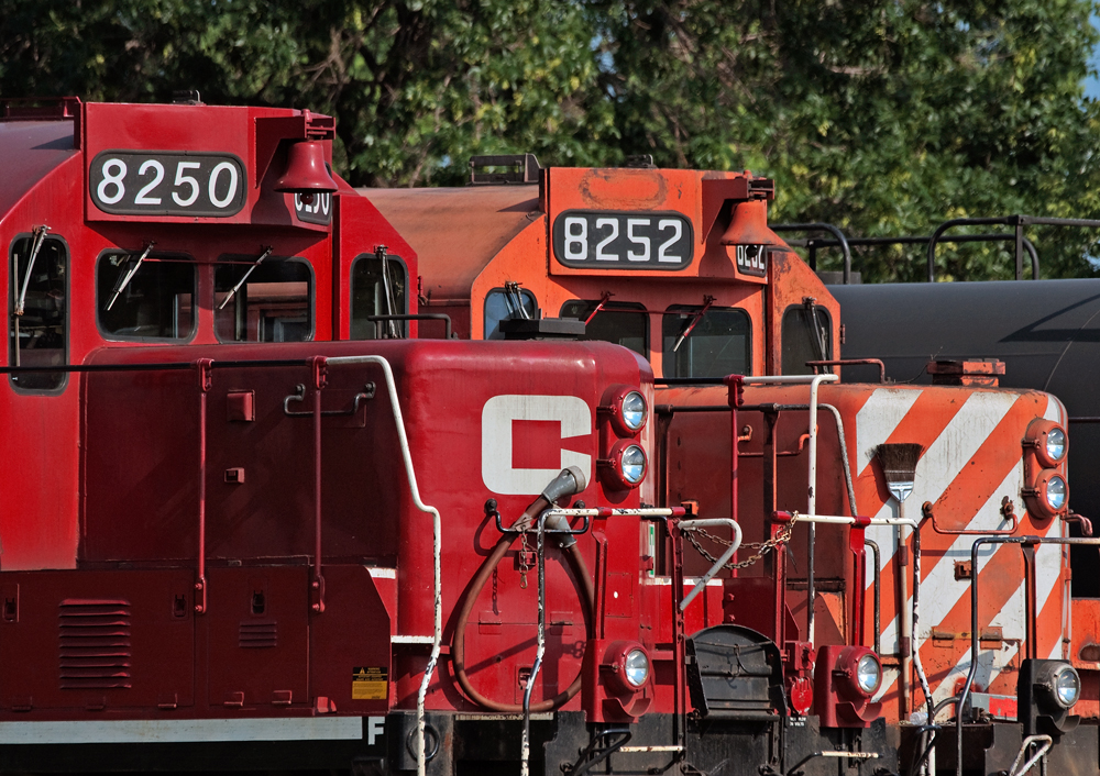 Two sisters of different paint schemes lay over at Lambton Yard awaiting there next assignments, CP 8250 (ex 1572), 8251(ex 1616, not shown) and 8252 (ex 1619) were already rebuilt into yard units back in the eighties for yard service only but retained transition, then renumbered into the 8200 series for road service when the demand for yard locomotives decreased.