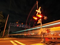 The last eastbound revenue GO train blasts through Clarkson making all station stops en route to Toronto and Oshawa, here they are knocking down the advance clear to limited signal on track two which is giving them advance warning that they will be crossing over onto track three, 2 miles east of here for their station stop at Port Credit. 