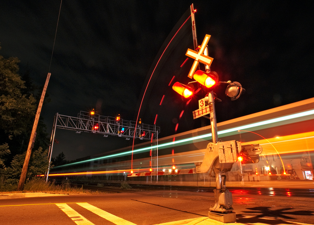 The last eastbound revenue GO train blasts through Clarkson making all station stops en route to Toronto and Oshawa, here they are knocking down the advance clear to limited signal on track two which is giving them advance warning that they will be crossing over onto track three, 2 miles east of here for their station stop at Port Credit.