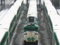 With a winter storm starting to hit hard for the drive home, GO Transit consists are dispatched deadheading from GO's Willowbrook Yard to Toronto Union Station where they will enter service. GO F59PH 541 leads an equipment move with Milton line train #155 into the raging snow. In the distance, the headlight of an eastbound can just be made out, as well as two newly delivered MP40's and a VIA F40 parked for wheel profiling.