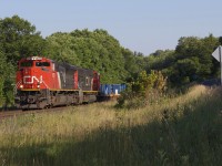 CN 107 throttles out of Dock Siding at the North Siding Switch with NS-style 8021 and 5602. I need to come here more often!