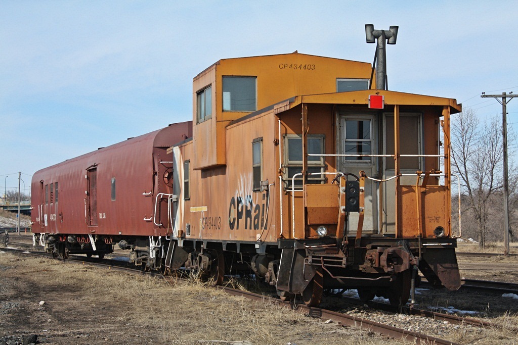 CP Van and tool car sit at the Brandon shop tracks.