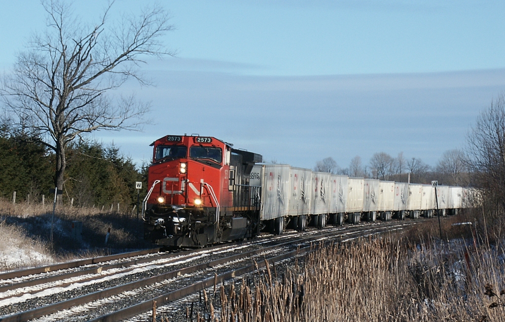 CN Roadrailer #183 was only seen in daylight on the Kingston sub if it was *really* late, as on this January morning in 2004. Seen at Metcalfe St (Concession 1), Newcastle.