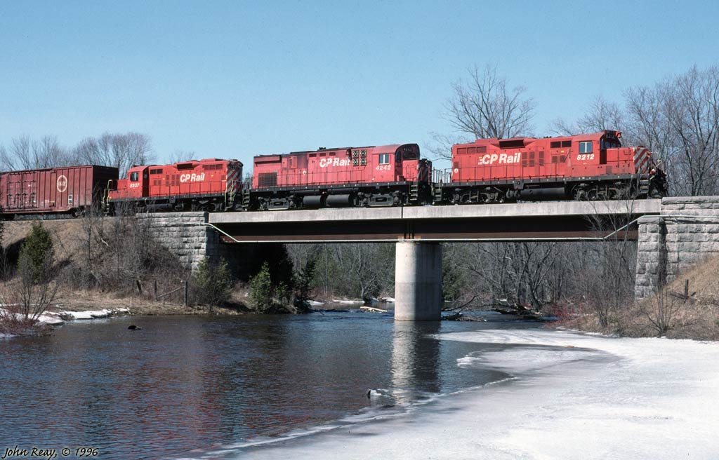 CP Havelock sub eastbound at Indian River bridge, west of Norwood, Ontario