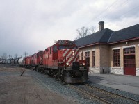 CP 8212 tiptoe-ing past the former CPR Peterborough station with a Havelock bound turn in March 1996.