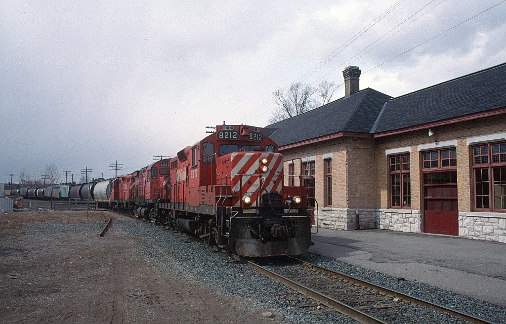 CP 8212 tiptoe-ing past the former CPR Peterborough station with a Havelock bound turn in March 1996.