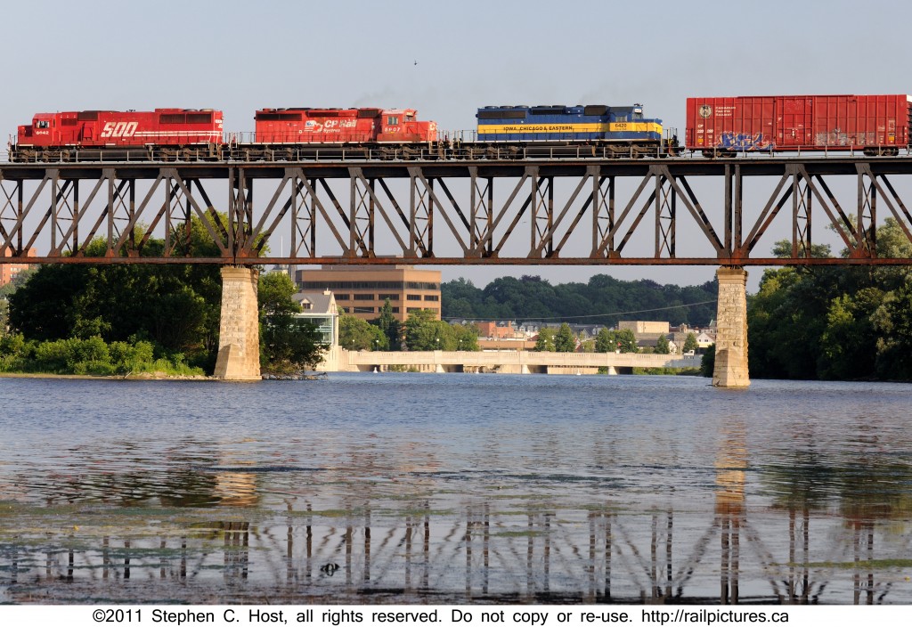 CP train 240 crosses high above the Grand River at Galt, Ontario with a motly crue of mixed Canadian Pacific Railway and subsidiary power.