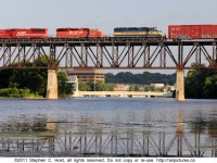 CP train 240 crosses high above the Grand River at Galt, Ontario with a motly crue of mixed Canadian Pacific Railway and subsidiary power.