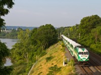 The early morning sun washes over Go Train 496 from Hamilton to Toronto behind unit 611 as she passes through Bayview Junction. Hamilton Bay is in the background.