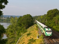 The early morning sun washes over Go Train 496 from Hamilton to Toronto behind unit 611 as she passes through Bayview Junction.  Hamilton Bay is in the background.  
