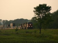 CN 149 coasts down hill towards Milton for a meet with 148 at sunset