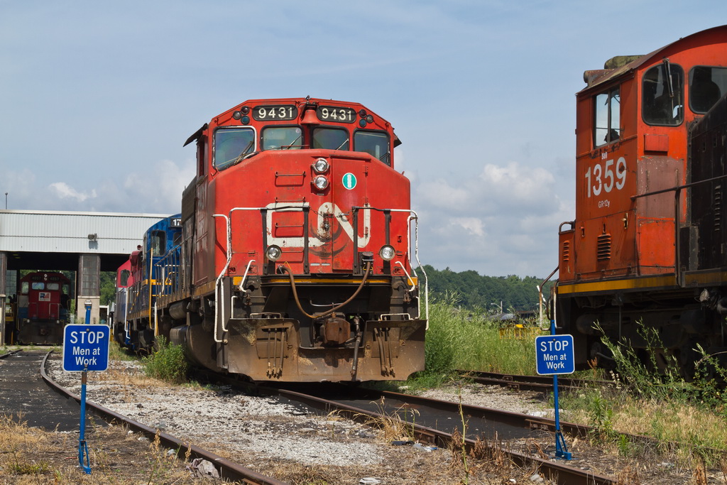 RMPX 9431, ex CN 9431 leads a mixed bag of power at the old CN shop at Hamilton.  Railink 1359 on the next track looks like she has made her last trip and is waiting final disposal.  She is also an ex CN unit.