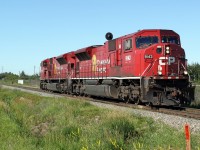 CP SD90MAC 9143 and 9154 head north on the CP Scotford sub in east Edmonton.  They have just crossed the diamond on the CN Camrose sub.  They are probably heading to pick up a train at CP\'s Clover Bar Yard. 