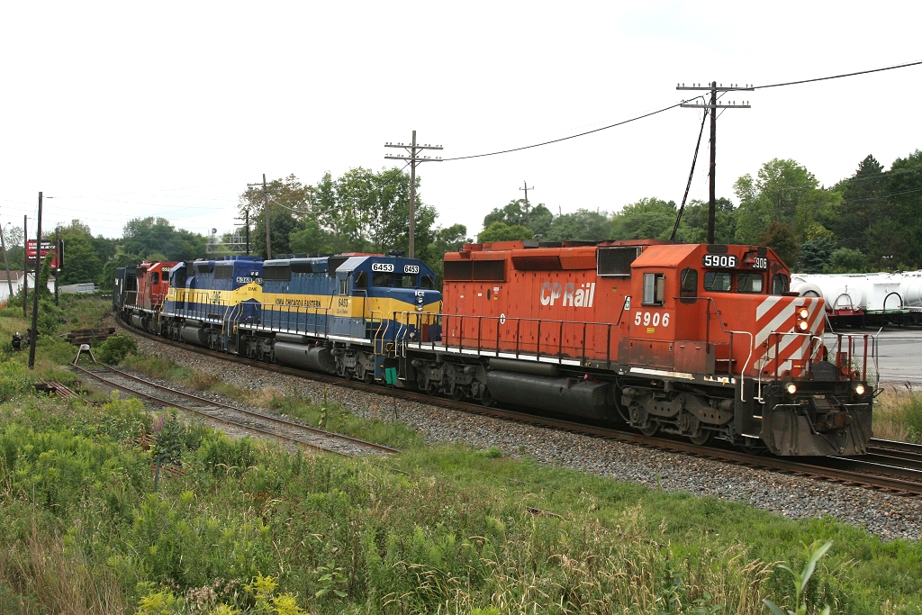 CP 5906, ICE 6453, DME 6368 and CP 5927 power train 666\'s ethanol loads through Streetsville.