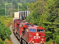 CP 8859, 8542, and 8557 race west with 115 just past the western Port Hope mileboard. 1718hrs.