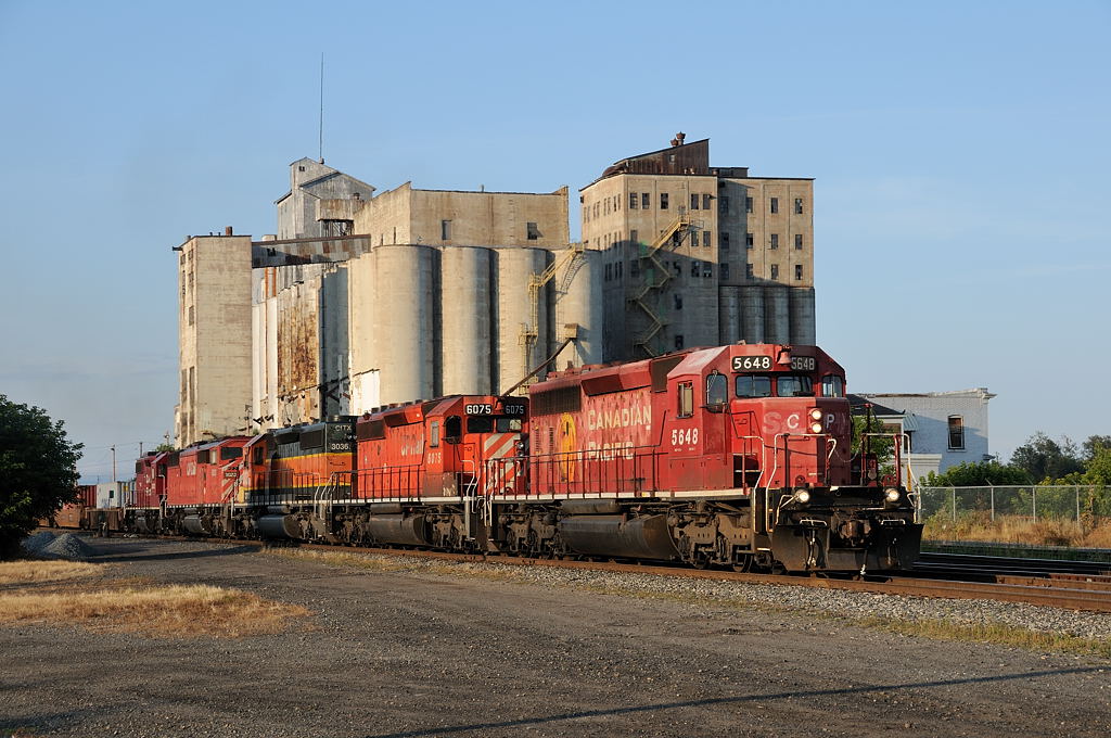 The former StL&H 5648, leads Toronto, ON to Winnipeg, MB manifest at Thunder Bay, posing infront of the dilapidated Pool 8 elevator. In this all GMD lash up are CP SD40-2\'s 5648-6075-CITX 3036-SD40-2F 9023-GP38-2 3032.