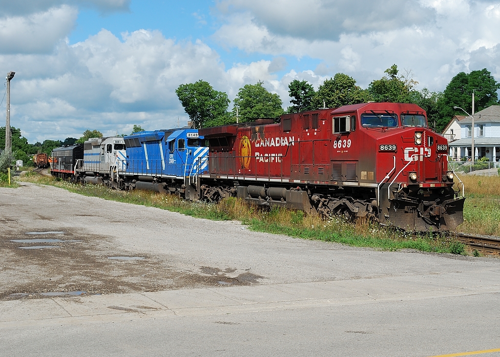 CP 242 pulls up to make a hot one car lift with a sweet lashup of 4 differnt locomotives in 4 differnt paint schemes. CP 8639(GE)+CEFX 3149(SD 45)+ CITX 3081(SD 40-2) + AZER 6070(E8)