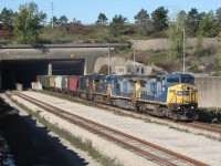 A detoured CSX grain train blasts out from the Welland Canal tunnel on CP's Hamilton Subdivision