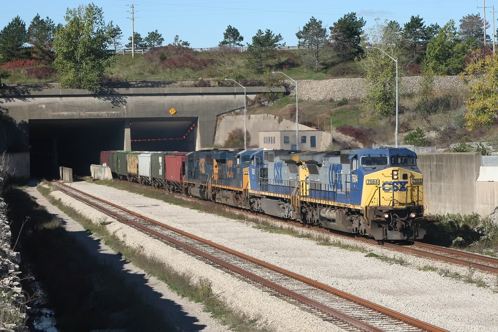 A detoured CSX grain train blasts out from the Welland Canal tunnel on CP\'s Hamilton Subdivision