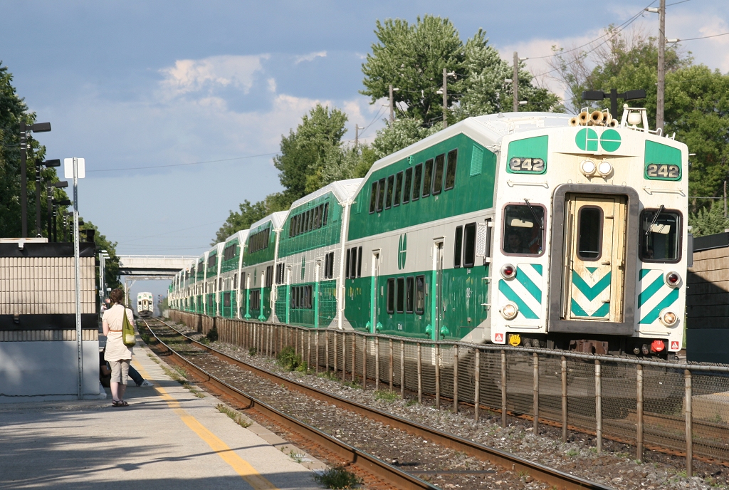 GO 242 flies by Long Branch at 80MPH with an express train as the all stops train approaches the station.