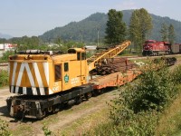 A former Great Slave Lake district crane sits in the backtrack at Arnold, BC.  Two CP coal trains can be seen in the background, held up by delays crossing the river back to CPR trackage