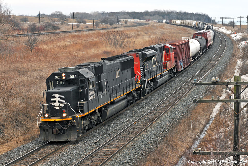 1st X371 rolls through Lovekin behind IC1007 and CN 8908. The crew described the 1007 as a \'piece of junk\' to a passing crew that ribbed them on having the pride of the fleet leading. BTW, 2nd X371 passed by an hour later. 1233