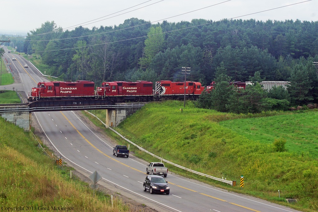 The Havelock Sub has very few bridges over traffic 5 to be exact,Simcoe street offers the nicest views seen is T08 3114,3045,3133 and the GP9 switcher for Peterborough 8206 in tow