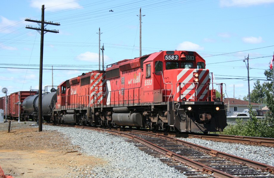 A CP freight heads eastbound at the beginning of the Ottawa Valley Railway\'s portion of the former CP Cartier subdivision at Romford.
