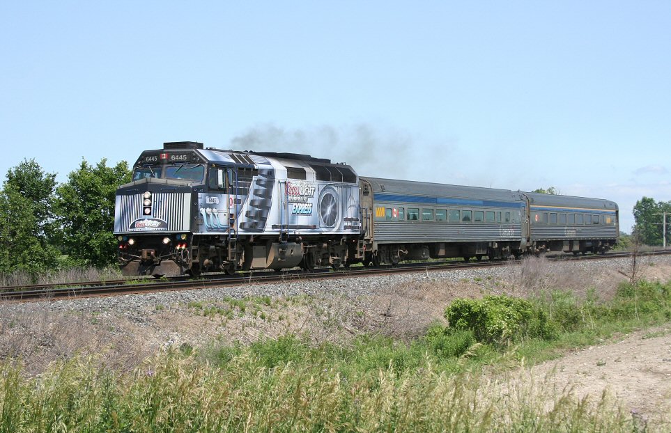 VIA 85 approaches Sarnia led by 6445 in a special Coors Light wrap.