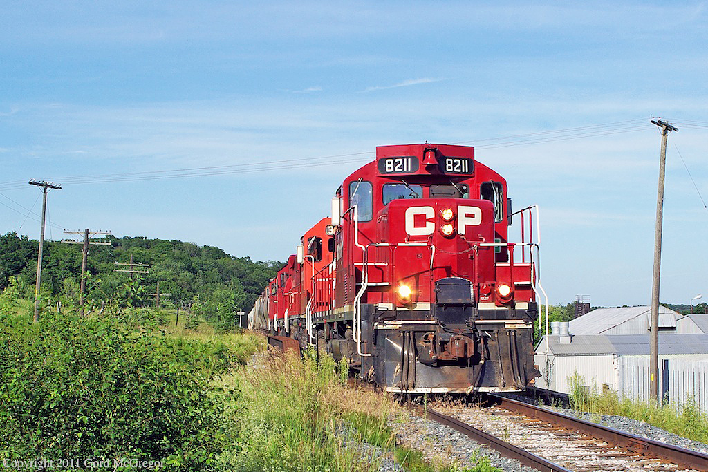 Leaving the hills of Purple Woods Conservation Area behind T07 crosses Simcoe st and Raglan Industries.