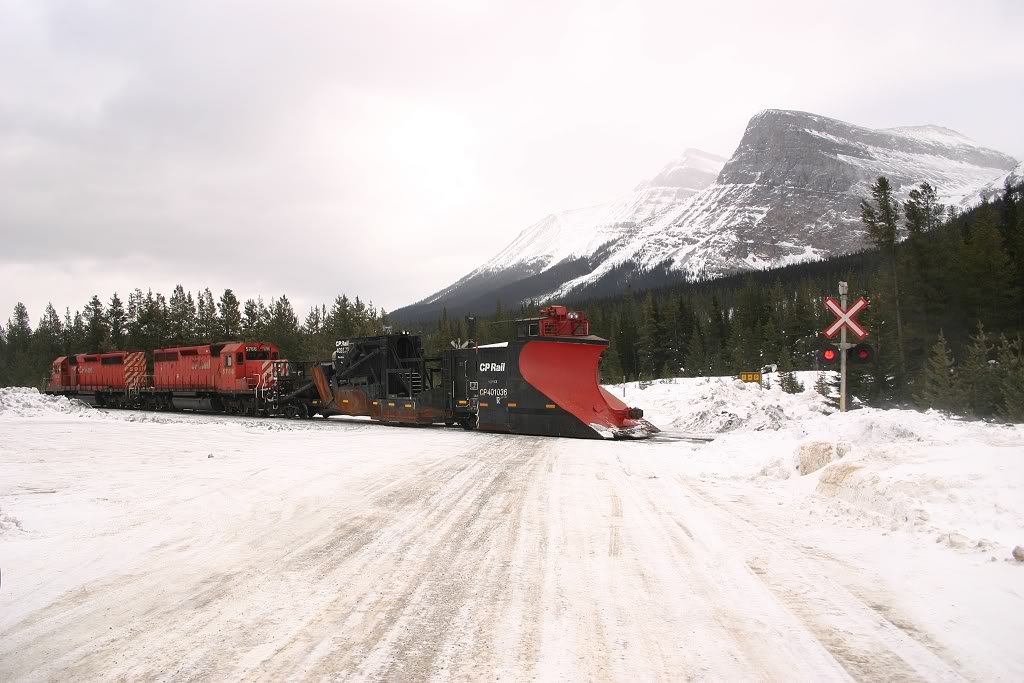 CP 5766 leads a plow extra over the Lake O\'Hara grade crossing heading to Partridge, Yoho and Cathedral to plow the snow off the mainline which fell after Parks Canada caused controlled avalanches in the eastern end of the Kicking Horse River Valley