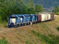 Kelowna Pacific Railway’s leased GP38-2s head for Kamloops on the former CN Okanagan Subdivision. 