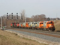 CN 399 backs into Aldershot Yard to make a lift with 7 ex-QNSL SD40-2\'s heading to the scrapper in Chicago.  The consist was: CN 2504, CN 5353, JCLX 259, JCLX 306, JCLX 305, JCLX 304, JCLX 261, JCLX 308, JCLX 303