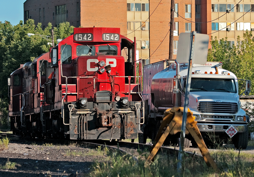 It\'s a perfect sunny morning in Hamilton as the CP mechanical guys prep, fuel and service Kinnear\'s 3 GP9u\'s for today\'s duty. The train will run light power down the hole into the industrial part of Hamilton on the east side of town to do National Steel Car, Stelco and US Steel.