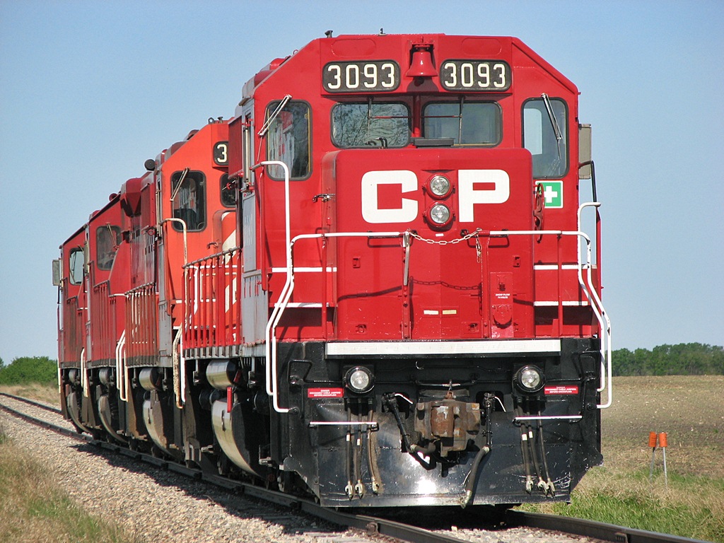 CP 3093 and three other GP38-2\'s sit at the end of the subdivision waiting for cars to be loaded and a crew to be ordered out.