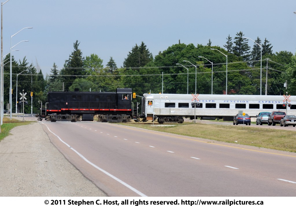 The Guelph Junction Express tourist train, on a rare mileage trip organize by the Guelph Historical Railway Association (http://www.ghra.ca) crosses the Hanlon Expressway as they tour the industrial spurs of the Guelph Junction Railway. This was the last (?) run of the GJE as they are shutting down after this date. Freight operations will contnue on the GJR, only the tourist train is affected.