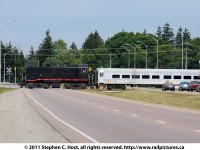 The Guelph Juction Express tourist train, on a rare mileage trip organize by the Guelph Historical Railway Association (http://www.ghra.ca) crosses the Hanlon Expressway as they tour the industrial spurs of the Guelph Junction Railway. This was the last (?) run of the GJE as they are shutting down after this date. Freight operations will continue on the GJR, only the tourist train is affected.