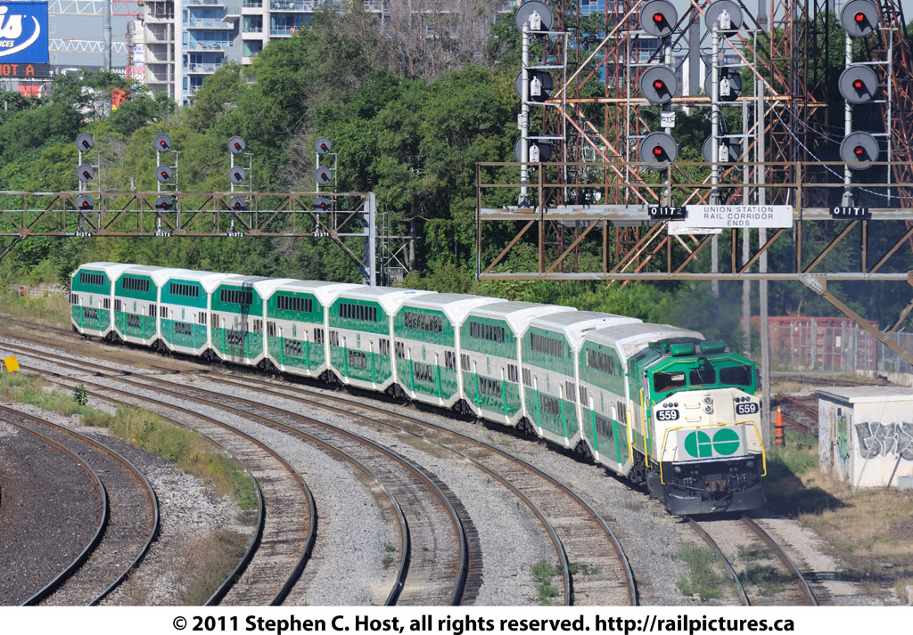 GO 559, a F59 and one of the few in active service has left the photographer in a cloud of diesel exhaust as it races towards Willowbrook yard for layover after the morning commuter rush at Union Station in Toronto. The signals in the distance denote the end of the Union Station Rail Corridor and beginning of the CN Oakville subdivision.