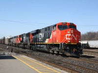 CN 2331 a new GEVO leads CN 332 through Brantford, with an IC SD40-2 Trailing