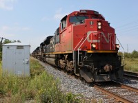 CN F328 heads towards Fort Erie on the Grimsby Subdivision with exceptional power, a re-route because of Hurricane Irene.