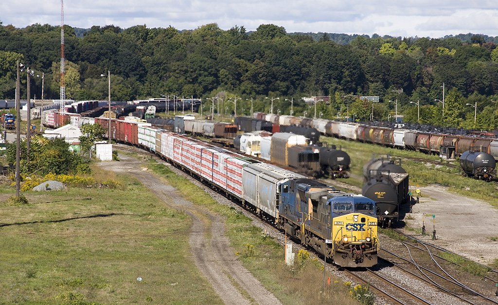 Almost a month from Hurricane Irene and the flash flooding and washouts that happened along the eastern coast, CN F32822-13 Norfolk Southern detour train rolls right along thru SOR Yard as it heads back to Fort Erie to be handed back to NS. CSX 371, CSX 4715 lead F328.