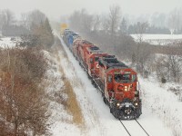 CP 5924 crests the Niagara Escarpment with the help of six other units during heavy snowfall. The leading three SD40-2s were taken from 446s train and tacked onto the front of 246-04.