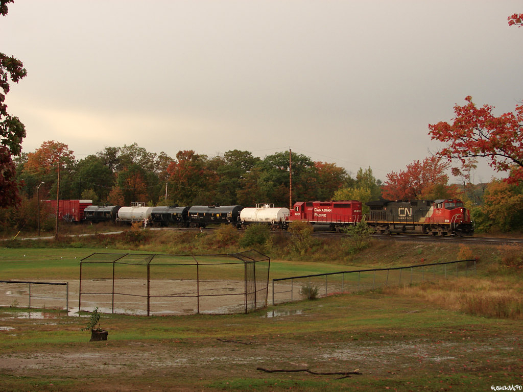 CN 2657 South approaching Station Name Sign MacTier with the help of CP 6000 on the Sudbury-Toronto assignment, train 436.