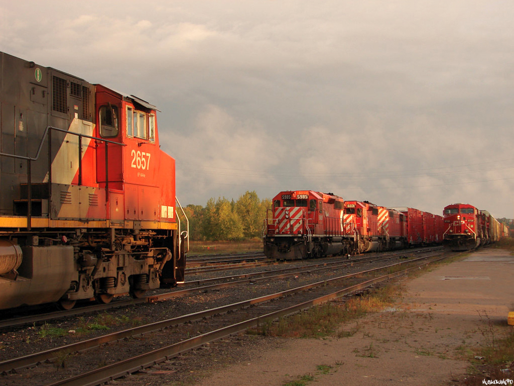 One of these things is not like the other! The MacTier \"parking lot\" is filling up tonight, as CN 2657 South (436) is waiting for a Toronto crew, while CP 5985 North (437) and CP 8728 North (103) both wait for MacTier crews to take over.