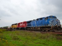 CP 242 led by CEFX 1007, freshly rebuilt CP 3038 and CITX 2799 head eastbound thru Tilbury on a cool cloudy afternoon.