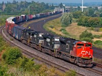 CN F32931 31 detour train rumbles through Whitby with a CN SD70M-2 leading three NS C40-9's and 8,434 ft of train, CN F329 met it's counterpart F328 at Liverpool just a few miles west of this location. This train was handed over to CN at Fort Erie from NS to be taken to Montreal due to washout conditions on account of hurricane Irene along the east coast.