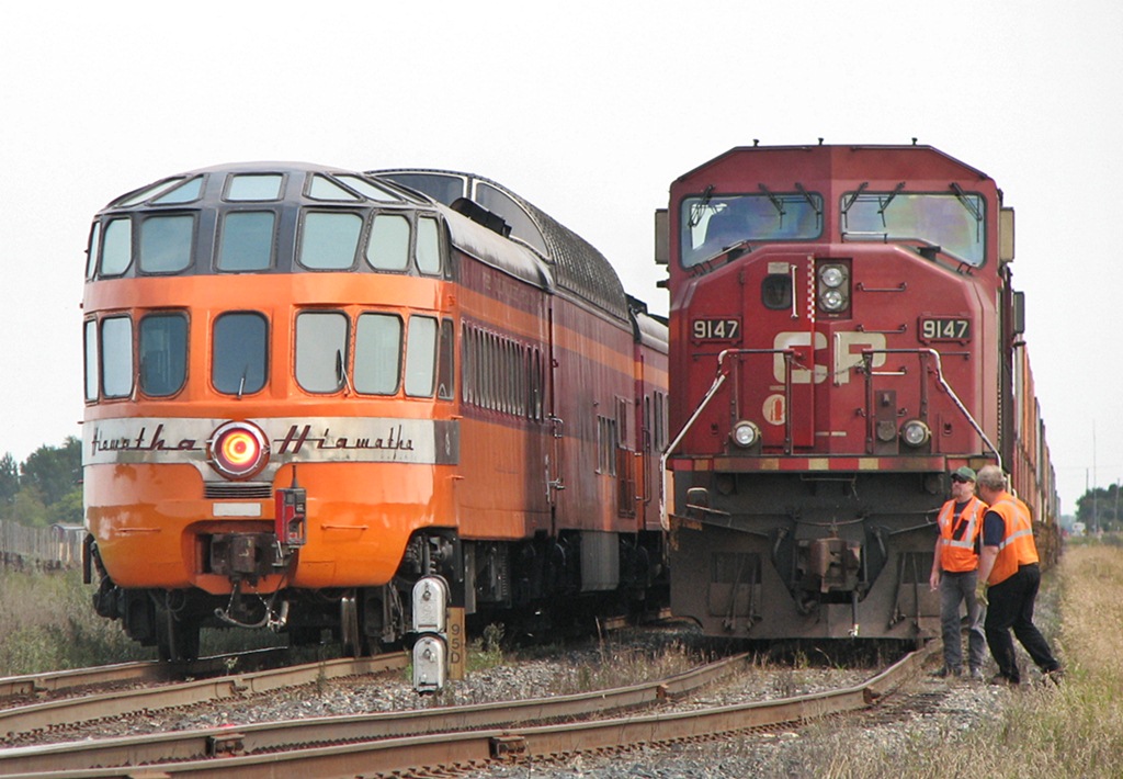 CP 9147 holds for the Empress as the Hiawatha observation car rolls on by.